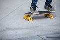Legs skateboarding on ctiy Royalty Free Stock Photo