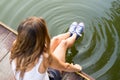 Legs in sneakers making circles in a water Royalty Free Stock Photo