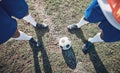 Legs, soccer and ball with a team ready for kickoff on a sports field during a competitive game from above. Football