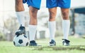 Legs, soccer and ball with a team ready for kickoff on a sports field during a competitive game closeup. Football