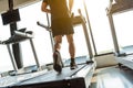 Legs of sportsman running on treadmill in fitness gym center. Sport and Healthy lifestyle concept. People workout and exercise Royalty Free Stock Photo