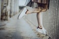 Legs teen girl in white sneakers on the bridge Royalty Free Stock Photo