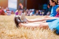 Legs of teenagers, music festival, in front of stage Royalty Free Stock Photo