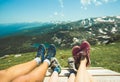 Legs of traveler family resting on a high mountain Royalty Free Stock Photo