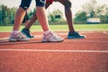 Legs of two athletes in sneakers Royalty Free Stock Photo