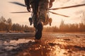legs of soldier walking through battle field with chopper in background , AI Generated Royalty Free Stock Photo