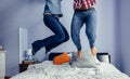 Unrecognizable couple jumping on the bed Royalty Free Stock Photo