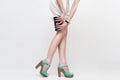 legs wearing high heels and hand bag Royalty Free Stock Photo