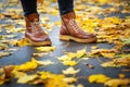 Legs of a woman in brown boots in autumn park Royalty Free Stock Photo