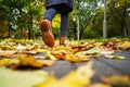 Legs of a woman in brown boots walking in a park Royalty Free Stock Photo