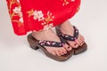 Legs of woman in Japanese kimono style. Geta, Japanese ornamental zori shoes Royalty Free Stock Photo