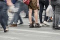 Legs of a woman standing in the middle of a crowd Royalty Free Stock Photo