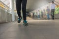 legs of a woman wearing Legging fitness wear sports shoes running in the city