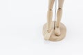 The legs of a wooden mannequin.