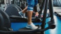 Legs work on elliptical trainer