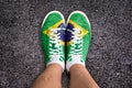 Legs wth sport shoes colored the brazilian flag