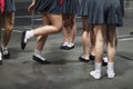 Legs of young female artists participating in the dance ensemble