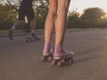 Legs of young woman roller skating in park Royalty Free Stock Photo