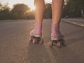 Legs of young woman roller skating in park Royalty Free Stock Photo