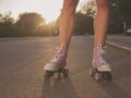 Legs of young woman roller skating in park Royalty Free Stock Photo