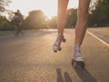 Legs of young woman roller skating in park Royalty Free Stock Photo