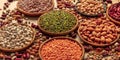 Legumes assortment on a brown background. Lentils, soybeans, chickpeas, red kidney beans