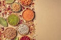 Legumes assortment, shot from above on a rustic brown background with copy space. Lentils, soybeans, chickpeas, red Royalty Free Stock Photo