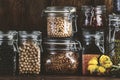 Legumes and beans. Dried, raw and fresh. Lentils, chickpeas, mung beans, soybeans, edamame, peas in glass jars. Healthy diet food Royalty Free Stock Photo