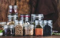 Legumes and beans. Dried, raw and fresh. Lentils, chickpeas, mung beans, soybeans, edamame, peas in glass jars. Healthy diet food Royalty Free Stock Photo