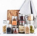 Legumes and beans set in jars. Dried raw lentils, chickpeas, mung beans, soybeans, edamame, peas. Healthy diet food, vegan protein Royalty Free Stock Photo