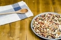 Legumes in a dish on wood, with spoon, close up, Royalty Free Stock Photo