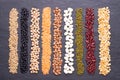 Legumes, lentils, chikpea, dry peas and beans on stone black background. Top view