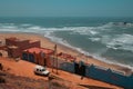 Legzira, Morocco - aerial view of Auberge Beach Club and the wild Atlantic Ocean coast on a sunny day.