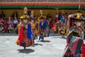 A group of Masked dancers in traditional Ladakhi Costume performing during the annual Hemis festival Royalty Free Stock Photo