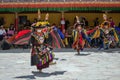 A group of Masked dancers in traditional Ladakhi Costume performing during the annual Hemis festival