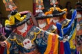 A group of Masked dancers in traditional Ladakhi Costume performing the Chaam Dance at annual Hemis festival