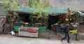 LEH, INDIA. MAY 5, 2016 : unidentified man walk pass Grocery store in Leh, North of India. Royalty Free Stock Photo