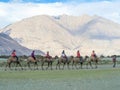 LEH LADAKH, INDIA-JUNE 24: Group of tourists are riding camels a