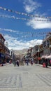Tourist pedestrian street in the city in the mountains