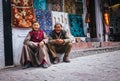 Leh , Ladakh region , India - August 20, 2016: Old Ladakhi people couple carpet sellers sitting on the street in Leh, India