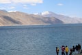 Tourist enjoying lake Pangong Taso lake situated on the border between India and china