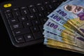 Lei banknotes on keyboard. Selective focus on stack of LEI romanian money Royalty Free Stock Photo
