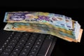 Lei banknotes on keyboard. Selective focus on stack of LEI romanian money Royalty Free Stock Photo