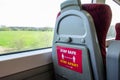 LEICESTER, ENGLAND- 3 April 2021: Social distancing stickers on seat tables on a Crosscountry train Royalty Free Stock Photo