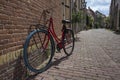 Colorful bike in a historical alley in the center of Leiden