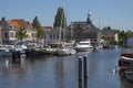 Historical harbour building the Volharding in the summer season in Leiden