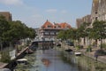 View of the Oranje Gracht towards the Zuidsingel, canal with trees, plants and boats in summer