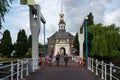 Leiden, Holland, The Netherlands - Three kids driving the bike at the old bridge in the historical city center