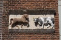 Leiden, Netherlands - August 3, 2018: Historical gable stone showing a horse and an ox, made in 1644 on a facade above a gate