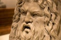 Sea god Okeanos on marble puteal from ancient Greece. Ancient greek empire. Face of man with beard. Greek Mythology.